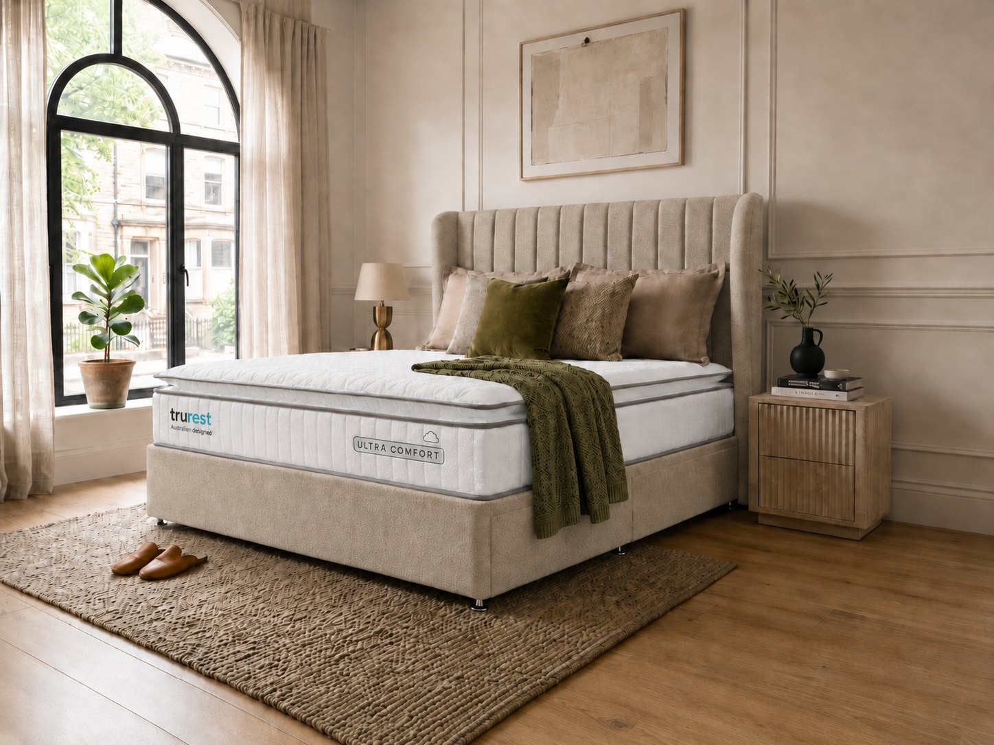 Trurest divan bed in a bright bedroom with arched window